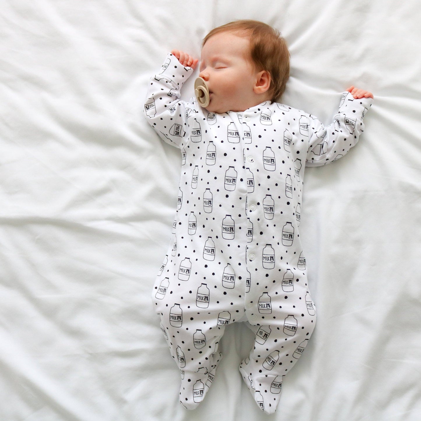 Fred & Noah - Milk Bottle cotton sleepsuit: Newborn